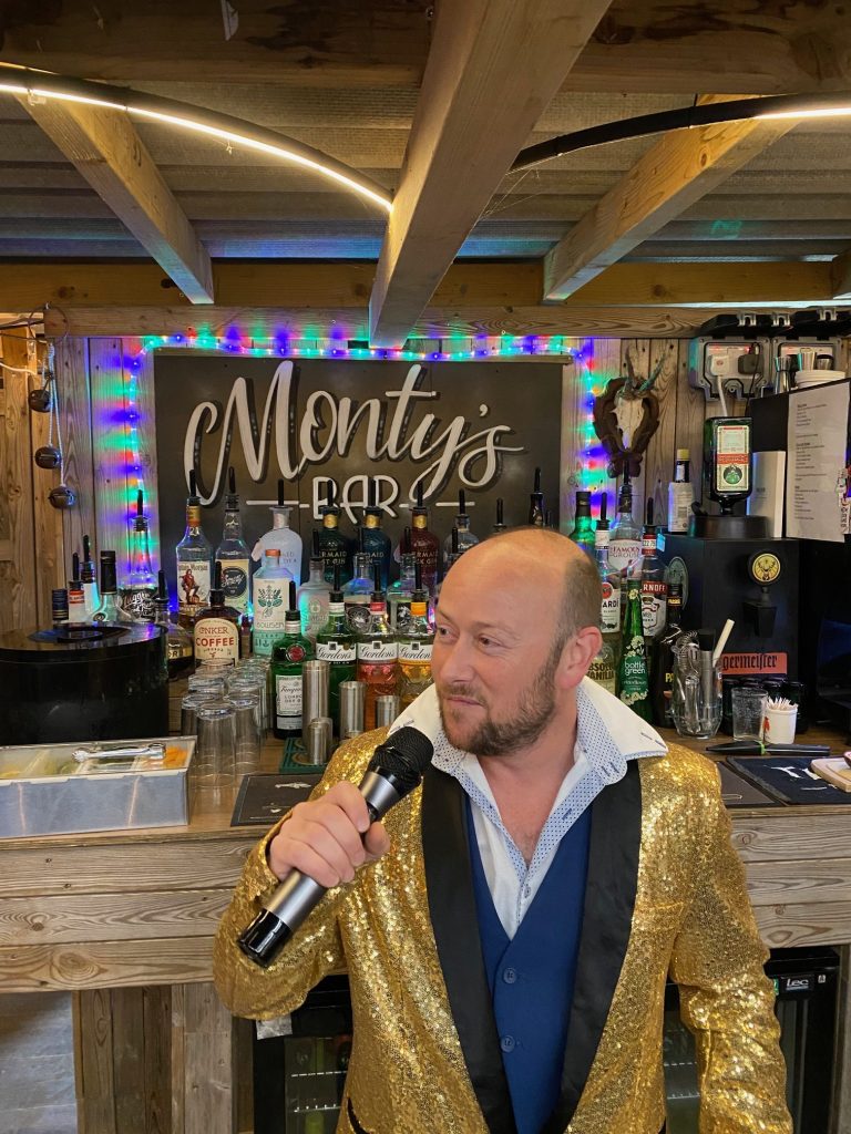 Peter Burns performs at Back of Beyond Touring & Glamping Park