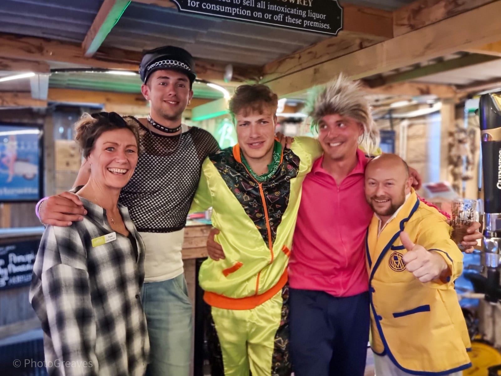 Some of the Back of Beyond team dressed in 80s outfits at Monty's Bar