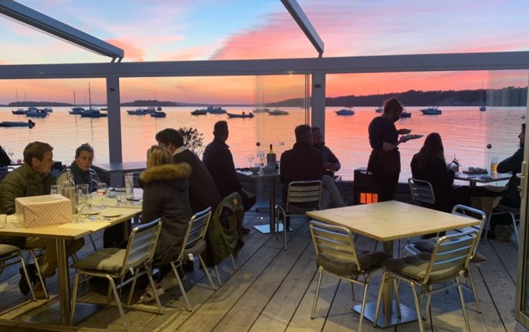 Inside Shell Bay restaurant at sunset.