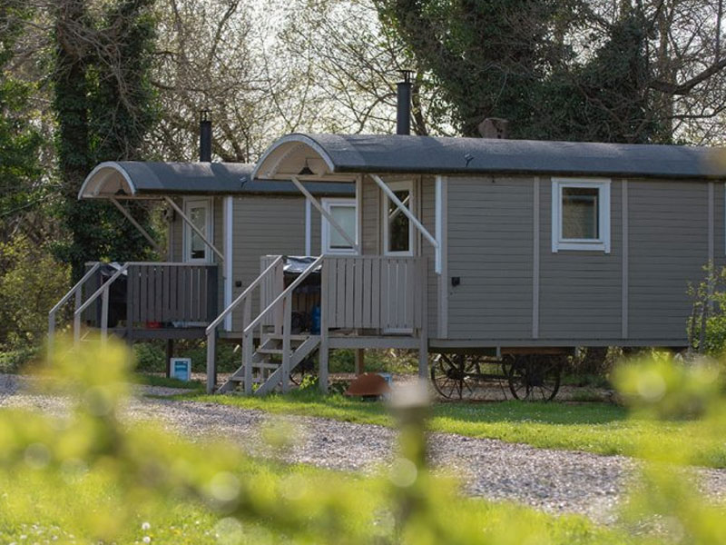 Shepherd huts at Back of Beyond Touring, Camping & Glamping Park in spring