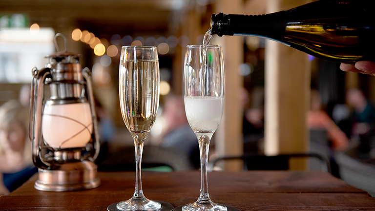 Champagne being poured into a champagne glass at Monty's Bar