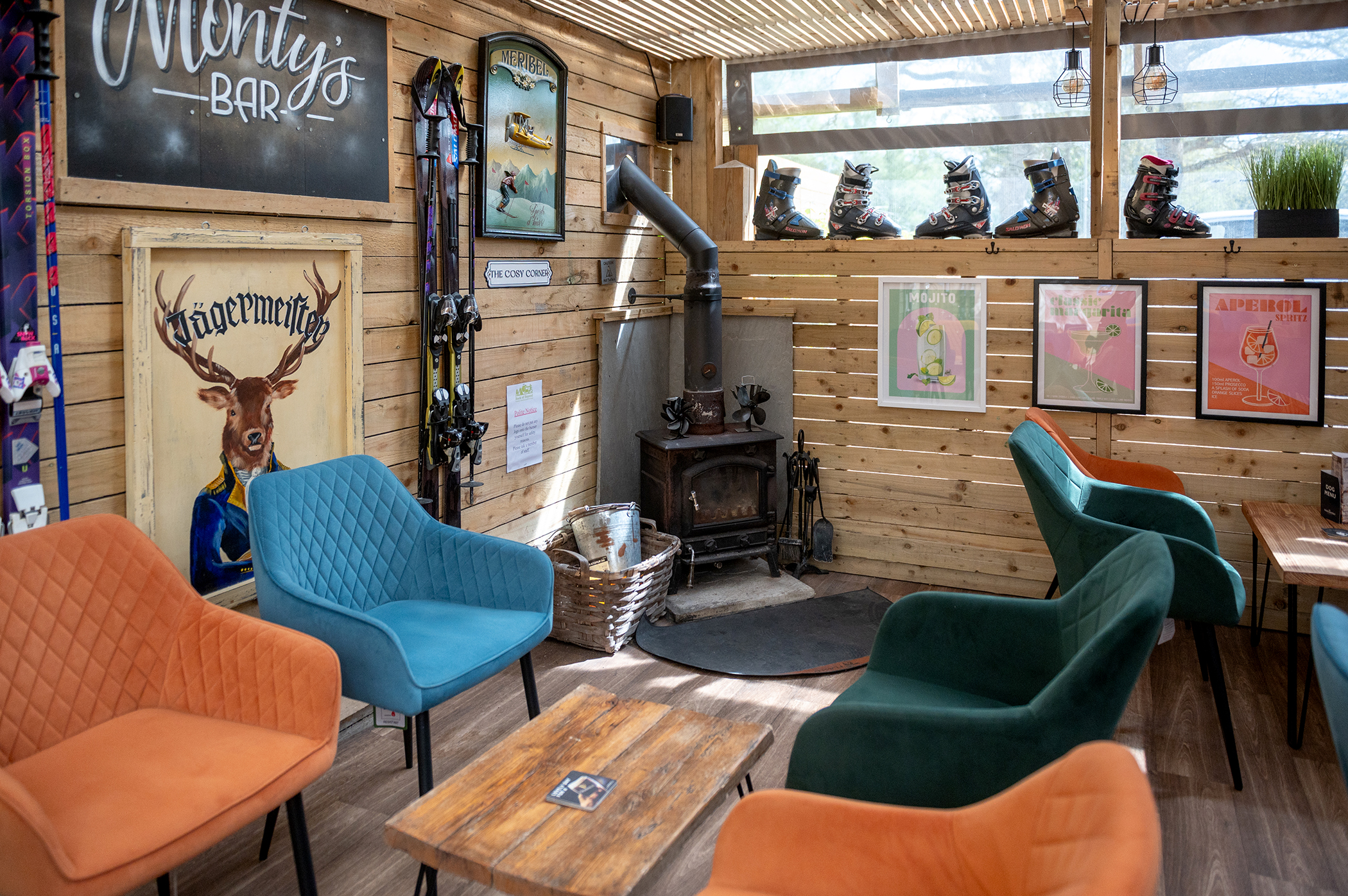 A corner of Monty's Bar with seating and a fireplace