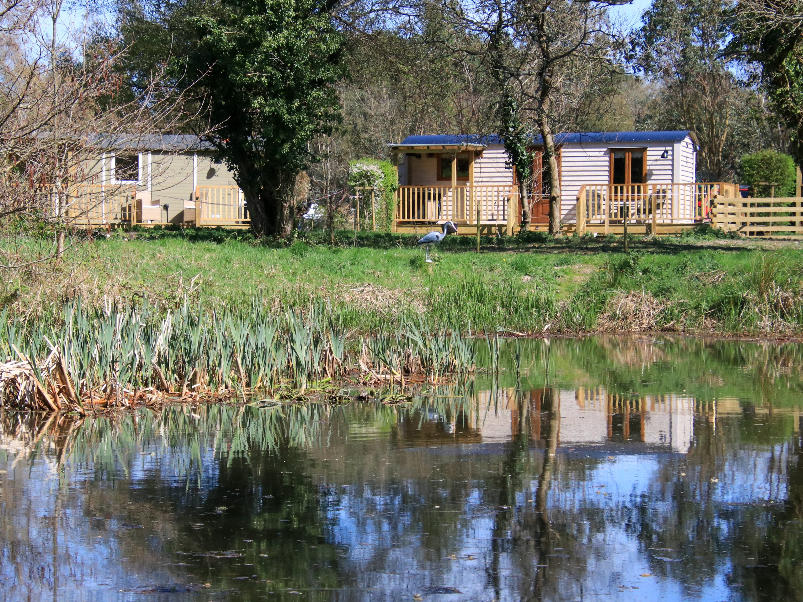 Looking across the wildlife lake to the shepherd huts