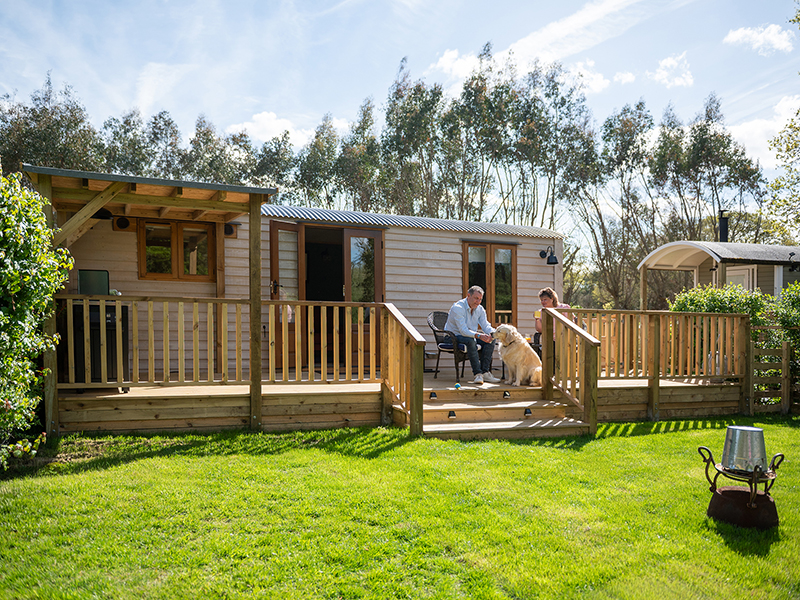The exterior and garden area of an ensuite shepherd hut