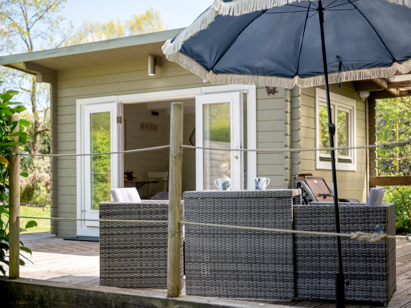 Decking area with outdoor seating outside Squirrel lodge