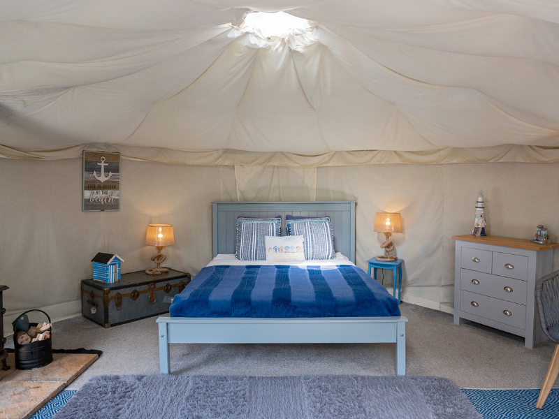 King sized bed and interior of the yurt
